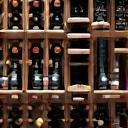 Elegant custom wine racking system with label-forward display and traditional diamond bins.